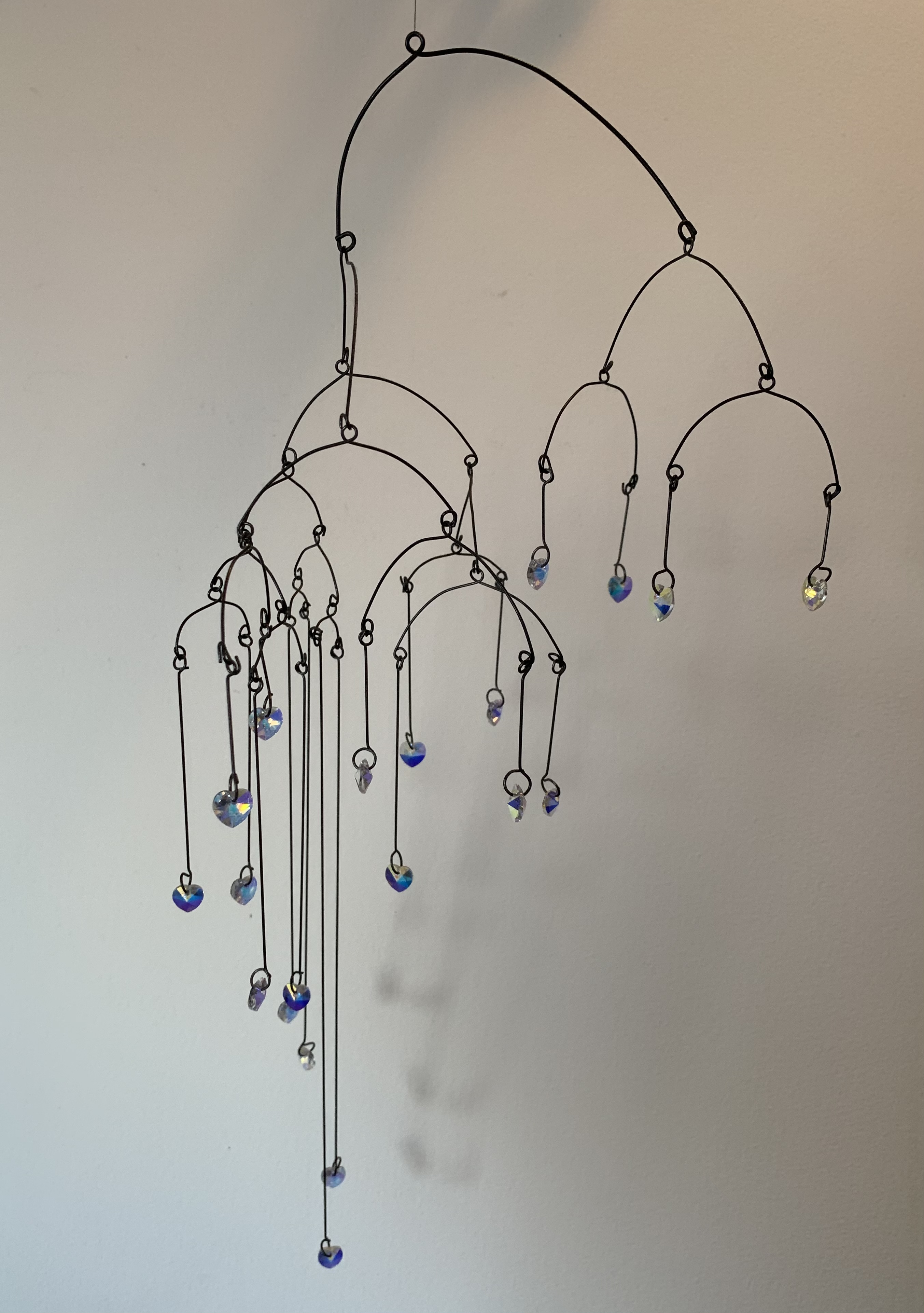 sparkly crystals hanging from wire as a mobile